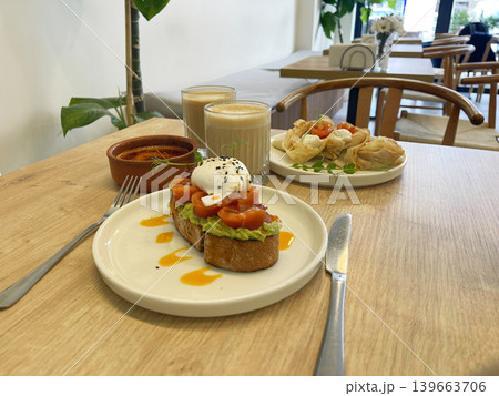 a salmon bruschetta plate and pancakes with salmon plate on the a salmon bruschetta plate and pancakes with salmon plate on the 139663706