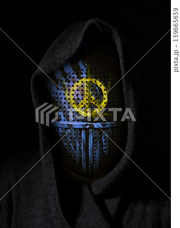 a mask painted in the colors of the Ukrainian flag a mask painted in the colors of the Ukrainian flag 139665659