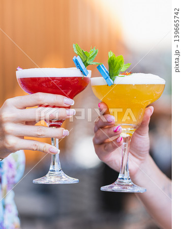 a couple drinking cocktails at a celebration 139665742