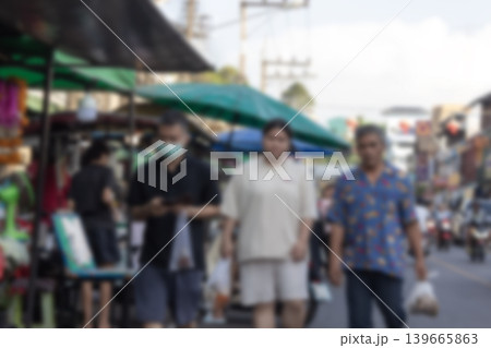 Blurred Roadside restaurants bustling with crowds 139665863
