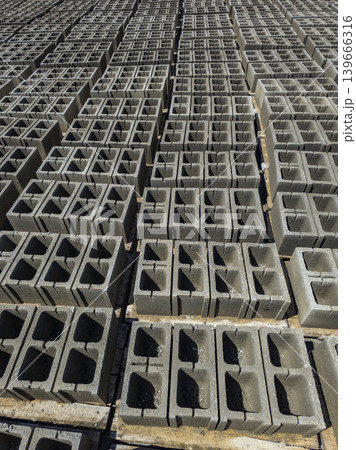 Rows of stacked concrete cinder blocks at construction site 139666316