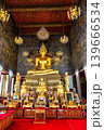 A golden statue of Phra Sri Shakyamuni Buddha in the main chapel of Wat Suthat Thepwararam in Bangkok, Thailand. 139666534