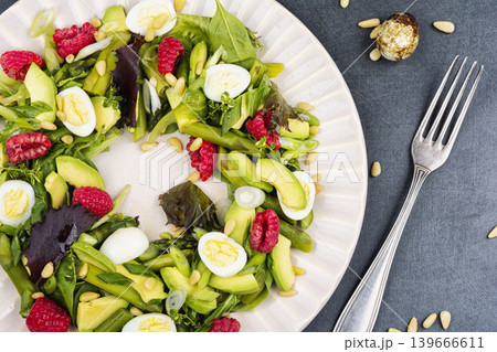Healthy Asparagus and Avocado Salad with Quail Eggs and Fresh Raspberries Healthy Asparagus and Avocado Salad with Quail Eggs and Fresh Raspberries 139666611