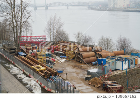 Riverbank staging showcasing assembly components and atmospheric conditions 139667162