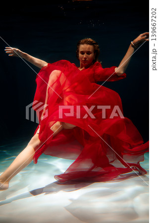Contemporary performer expressing dynamic underwater choreography vividly Contemporary performer expressing dynamic underwater choreography vividly 139667202