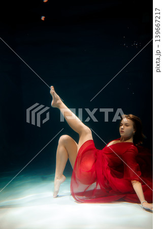 Glamorous underwater scene with glowing skin and refined makeup Glamorous underwater scene with glowing skin and refined makeup 139667217