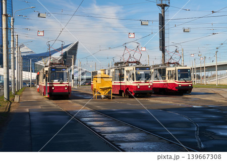 Red vehicle and technician conducting inspection on busy transit platform Red vehicle and technician conducting inspection on busy transit platform 139667308