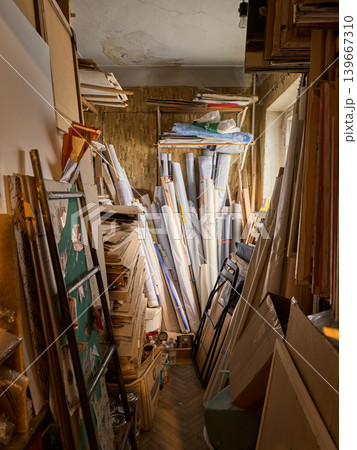 Chaotic Space For Art Pieces And Tools. Cluttered Storage Area Filled With Art And Art Supplies Chaotic Space For Art Pieces And Tools. Cluttered Storage Area Filled With Art And Art Supplies 139667310