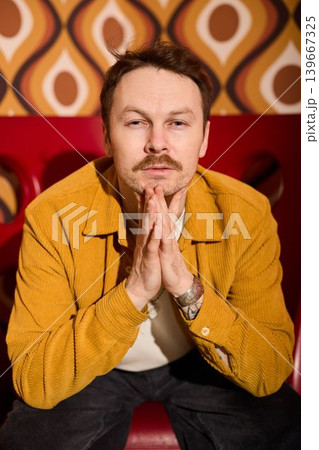 Contemplative gentleman in retro space with cinematic ambiance 139667325