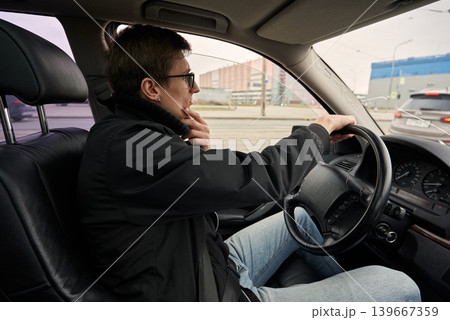 Caucasian driver checking route and thinking while driving 139667359