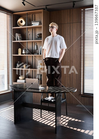 Person prepares display and speech in afternoon light setting 139667387