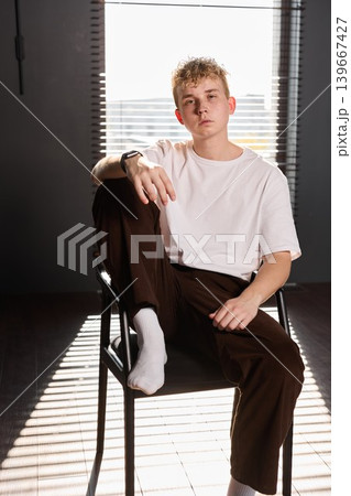 Tranquil male figure practicing meditation in peaceful environment Tranquil male figure practicing meditation in peaceful environment 139667427