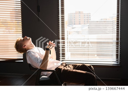 Man thoughtfully studies growth and architecture of city skyline Man thoughtfully studies growth and architecture of city skyline 139667444