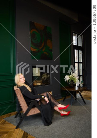 Poised female with fashionable attire in cozy upscale environment Poised female with fashionable attire in cozy upscale environment 139667509