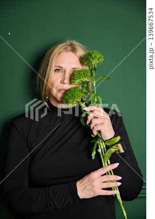 White woman influencer glamour portrait with chrysanthemum White woman influencer glamour portrait with chrysanthemum 139667534