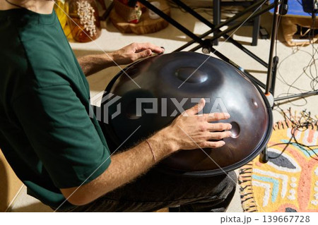 Closeup of hands creating ambient sound with equipment and lighting Closeup of hands creating ambient sound with equipment and lighting 139667728
