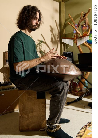 Musician developing music in personal living space with instruments Musician developing music in personal living space with instruments 139667755