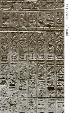 Beautiful bas-reliefs and ancient hieroglyphs in the Temple of Seti I in Abydos, Egypt. 139668155