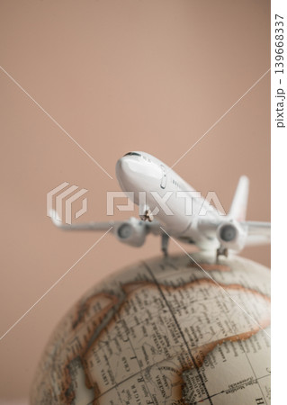 Airplane on globe close up, international travel tourism transportation and global destination concept Airplane on globe close up, international travel tourism transportation and global destination concept 139668337