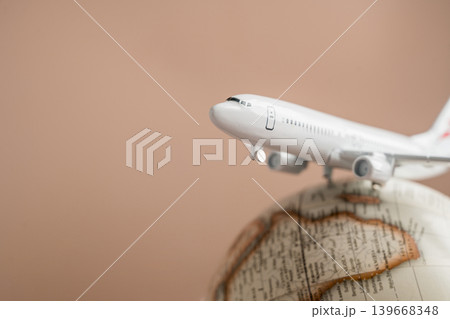 Airplane on globe close up, international travel tourism transportation and global destination concept 139668348