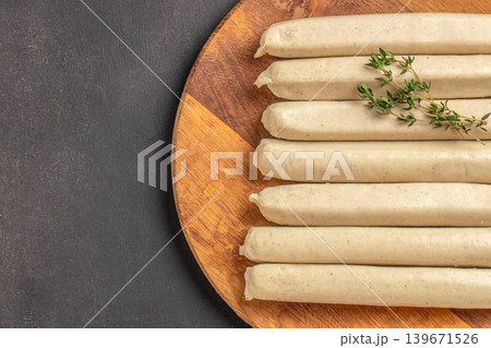 White sausages on wooden board close up White sausages on wooden board close up 139671526