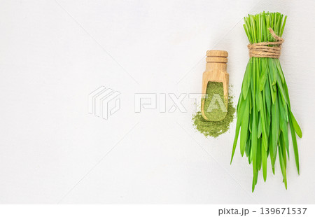 Sprouted wheat grass and wheat sprouts isolated on white background Sprouted wheat grass and wheat sprouts isolated on white background 139671537