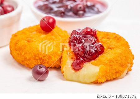 Cheese croquettes with cranberry sauce closeup on light background 139671578