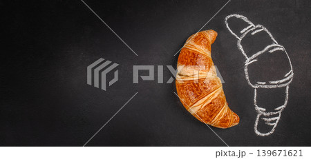 Fresh croissant with chalk pastry sketch on black background, creative bakery concept Fresh croissant with chalk pastry sketch on black background, creative bakery concept 139671621