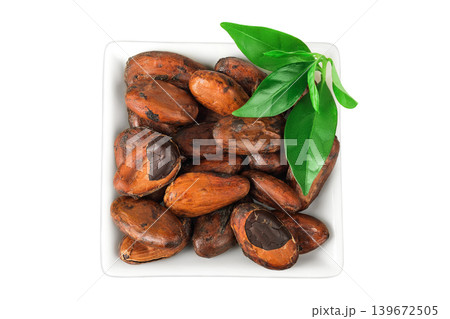 cocoa beans in ceramic bowl isolated on white background. Top view. Flat lay cocoa beans in ceramic bowl isolated on white background. Top view. Flat lay 139672505