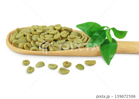 Green coffee beans in wooden spoon isolated on white background Green coffee beans in wooden spoon isolated on white background 139672506