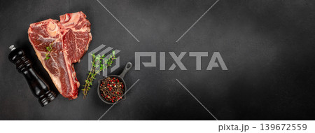 Raw porterhouse t-bone steak with spices and herbs on dark background with copy space for premium food advertising and steakhouse banners Raw porterhouse t-bone steak with spices and herbs on dark background with copy space for premium food advertising and steakhouse banners 139672559