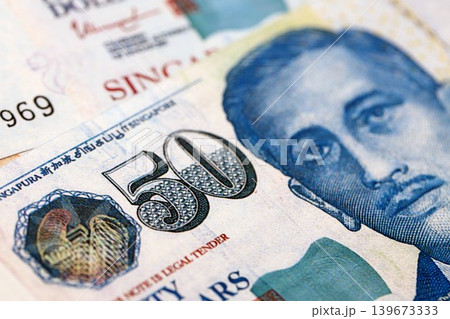 Singapore Dollar currency money bills. SGD currency banknotes in stack Singapore Dollar currency money bills. SGD currency banknotes in stack 139673333
