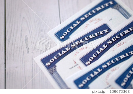 Social security number cards on white wooden background surface Social security number cards on white wooden background surface 139673368