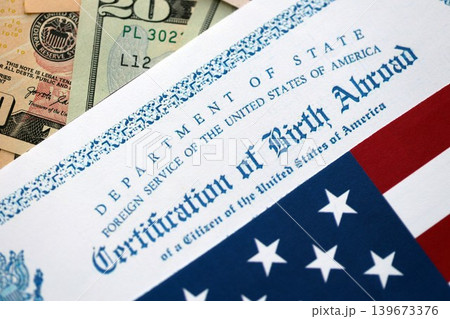 Certification of Birth Abroad with US flag and US dollar money bills Certification of Birth Abroad with US flag and US dollar money bills 139673376