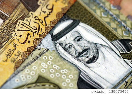 Saudi Arabia riyal money bills banknotes lies in big pile on table. Business in Saudi Arabia 139673493