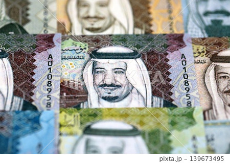 Saudi Arabia riyal money bills banknotes lies in big pile on table. Business in Saudi Arabia Saudi Arabia riyal money bills banknotes lies in big pile on table. Business in Saudi Arabia 139673495