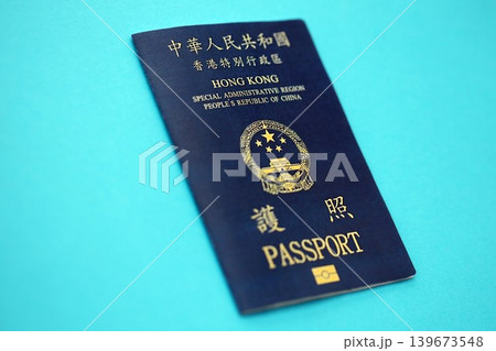Hong Kong Special Administrative Region HKSAR Passport lies on blue table background close up 139673548