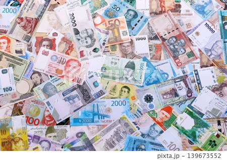 Different various money bills banknotes from random currencies of the world Different various money bills banknotes from random currencies of the world 139673552