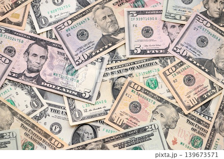 Lot of dollars close up. Stack of dollars and cash with a money background 139673571