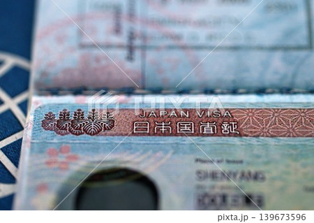 Detail of Japan visa applied on passport. Japanese visa header in passport page Detail of Japan visa applied on passport. Japanese visa header in passport page 139673596