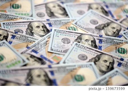 Money background with Franklin on the 100-dollar note. Texture of US dollar currency and banknotes Money background with Franklin on the 100-dollar note. Texture of US dollar currency and banknotes 139673599
