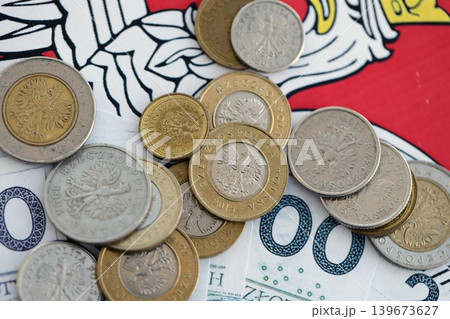Banknotes of Polish zloty and grosz coins currency on polish flag. Poland PLN money 139673627