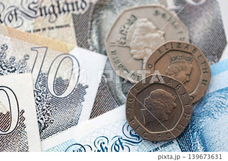 Coins and banknotes of United Kingdom and Great Britain pound currency. UK money close up 139673631