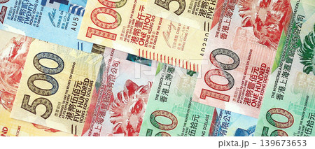 Big pile of Hong Kong dollars money bills banknotes. Lots of money of Chinese Hong Kong HKD cash Big pile of Hong Kong dollars money bills banknotes. Lots of money of Chinese Hong Kong HKD cash 139673653