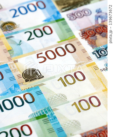 Russian ruble paper banknotes pile on table. Russia RUB currency money bills in big amount Russian ruble paper banknotes pile on table. Russia RUB currency money bills in big amount 139673672