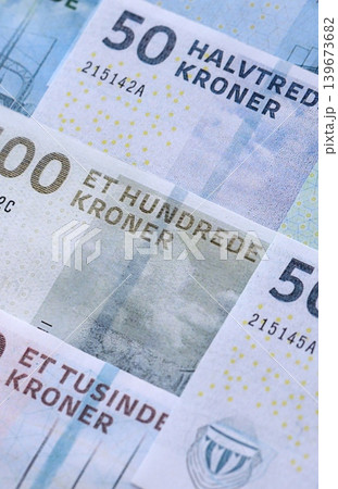 Danish krone paper banknotes pile on table. Denmark DKK currency money bills in big amount Danish krone paper banknotes pile on table. Denmark DKK currency money bills in big amount 139673682