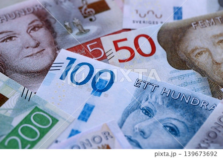 Swedish krona paper banknotes pile on table. Sweden SEK currency money bills in big amount Swedish krona paper banknotes pile on table. Sweden SEK currency money bills in big amount 139673692