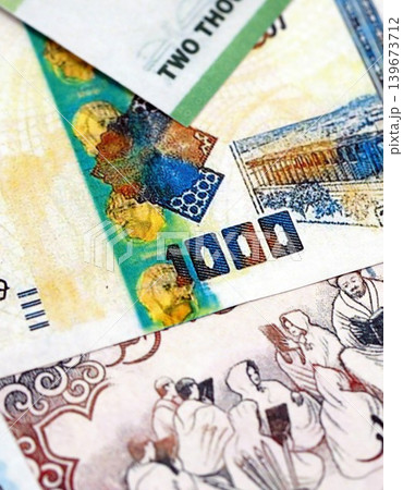 Algerian dinar paper banknotes pile on table. Algeria DZD currency money bills in big amount 139673712