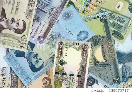 Iraqi dinar paper banknotes pile on table. Iraq IQD currency money bills in big amount 139673717