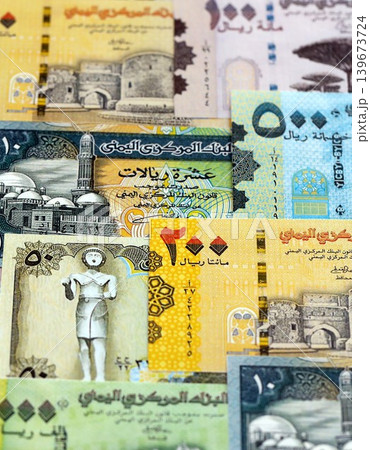 Yemeni rial paper banknotes pile on table. Yemen YER currency money bills in big amount 139673724